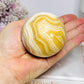 Orange Calcite Sphere on Stand 335g