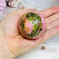 Thulite Sphere with Epidote 209g On Stand