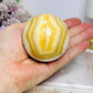 Orange Calcite Sphere on Stand 335g