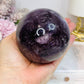 Large High Grade Phantom Amethyst Sphere with Rainbows On Stand 665g